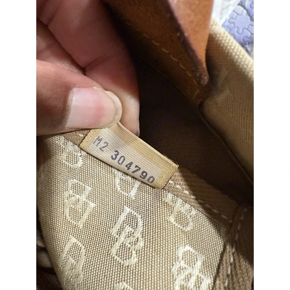 Dooney and Bourke Beige Canvas and Leather Signature Tassel Tote Handbag‎